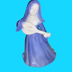 Blue Ceramic Nun Figurine with Musical Instrument